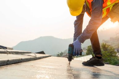 Roofer installing a roof system